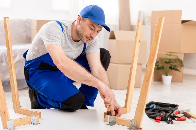 Technician assembling a bed frame